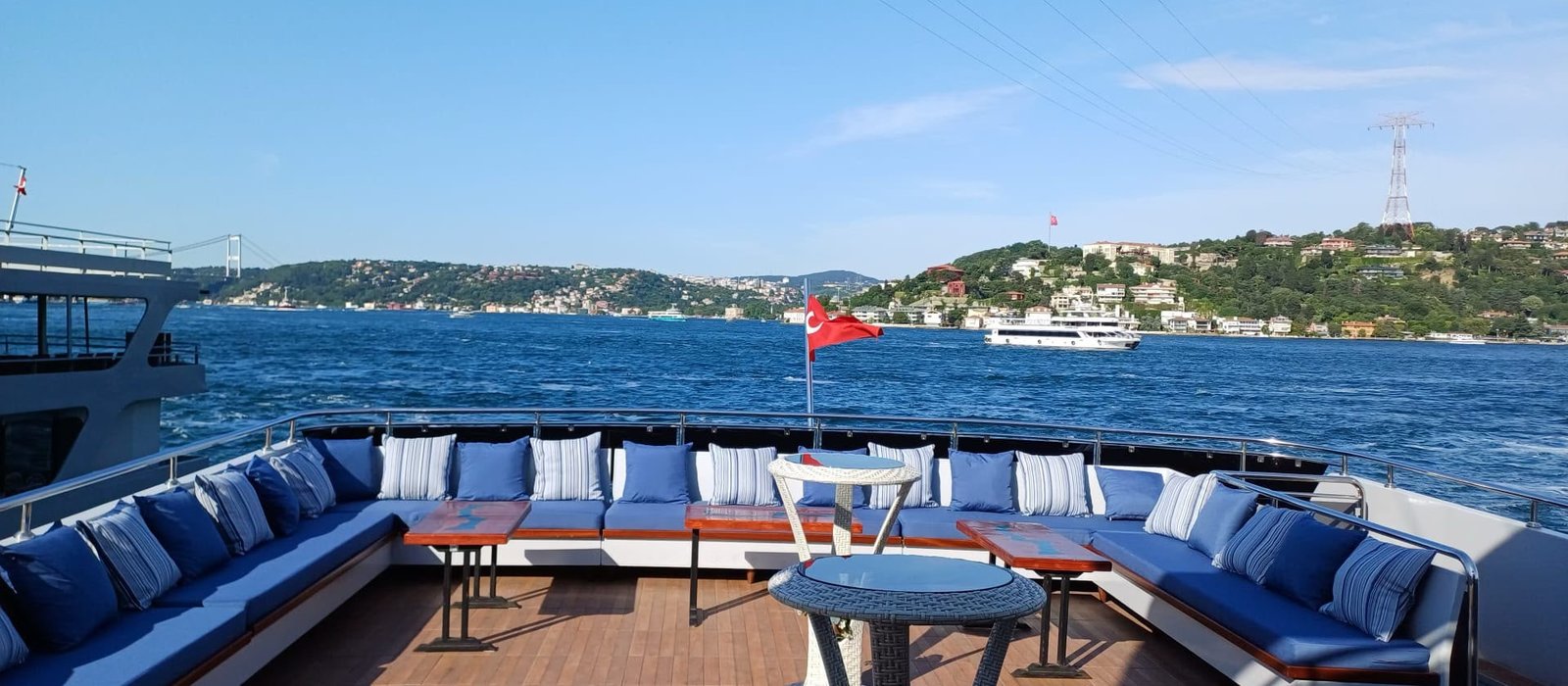 Private yacht deck on the Bosphorus with Turkish flag